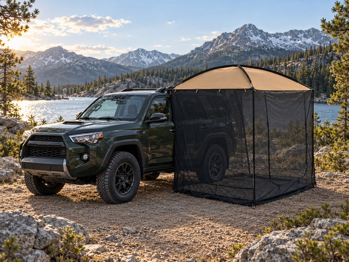 AT200 tan awning tent beside a green SUV at a mountain lake