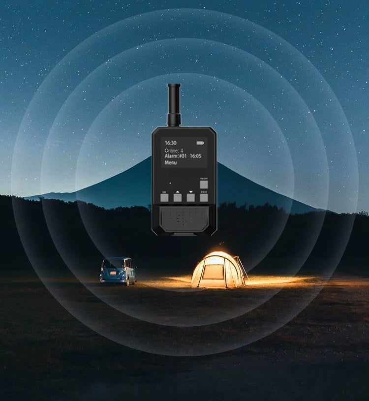 Basecamp handheld receiver alerting at a night campsite