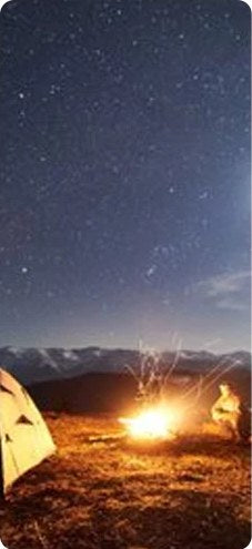 Campfire under a starry night sky