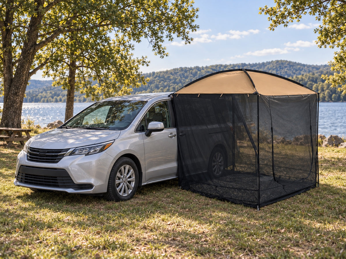 AT200 tan awning tent beside a silver family minivan at a lakeside campsite