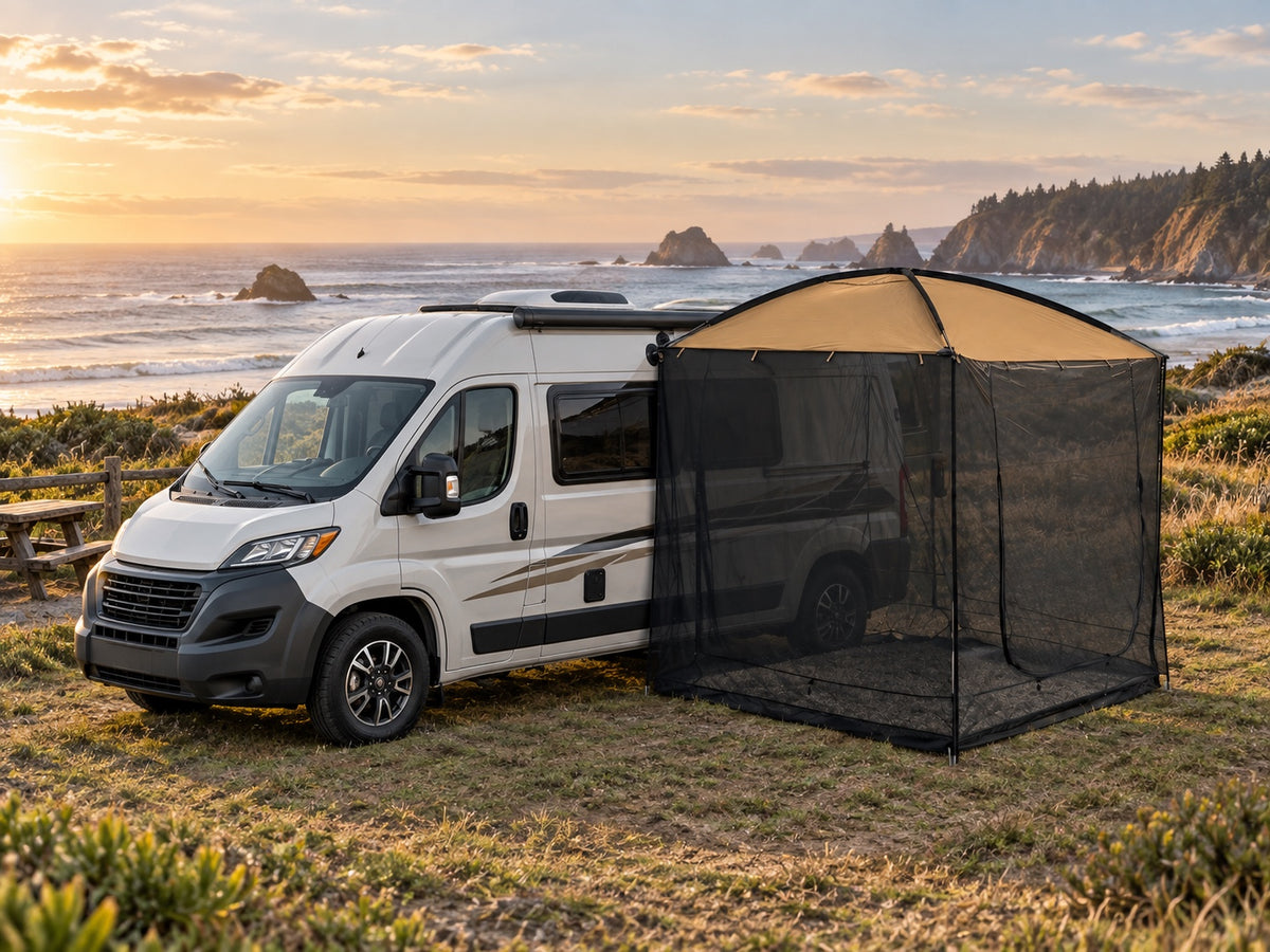 AT200 tan awning tent beside a compact camper RV at a coastal campsite